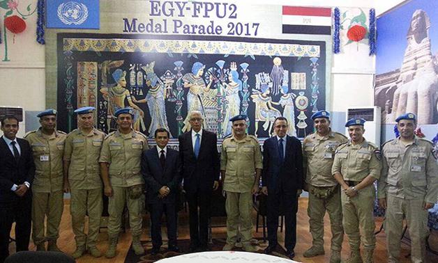 Deputy Foreign Minister for African Affairs Hamdi Loza (M) getting recognized for his visit to the Egyptian Formed Police Unit headquarter  – Press photo