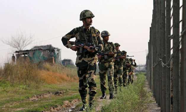 India's Border Security Force (BSF) soldiers patrol along the fenced border with Pakistan in Ranbir Singh Pura sector near Jammu February 26, 2019. REUTERS/Mukesh Gupta
