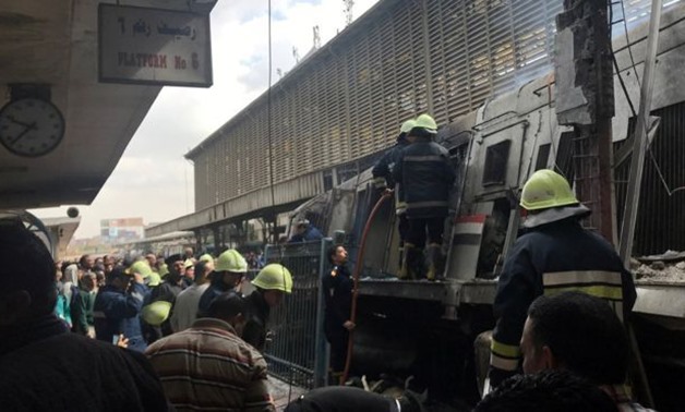 PRESS: Firefighters and medics gather at the scene of the fiery train crash at the Egyptian capital Cairo's main railway station on February 27, 2019