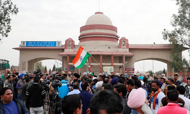 People and media gather before the arrival of Indian Air Force pilot, who was captured by Pakistan, near Wagah border, on the outskirts of the northern city of Amritsar, India, March 1, 2019. REUTERSi