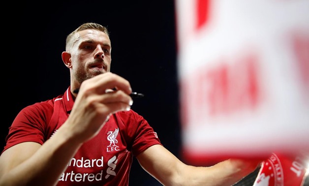 Liverpool, Britain - August 7, 2018 Liverpool's Jordan Henderson signs autographs for fans Action Images via Reuters/Carl Recine