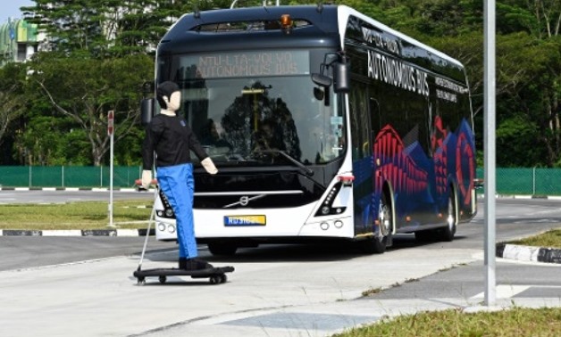 A Volvo AB 7300 electric autonomous bus drives on the track of Center of Excellence for Testing & Research of Autonomous Vehicles after being launched in Singapore- AFP