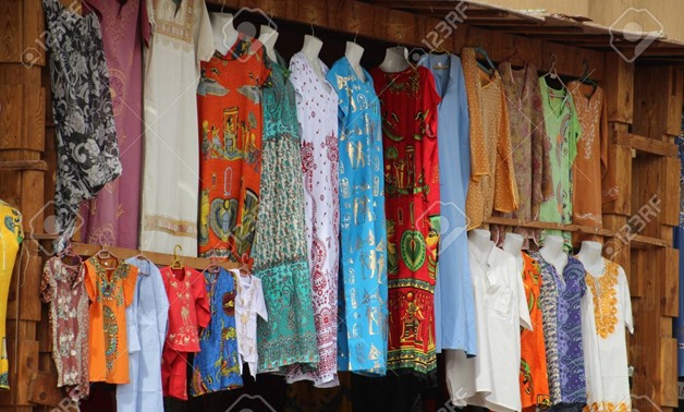 Brightly coloured garments for sale in an Egyptian market - CC