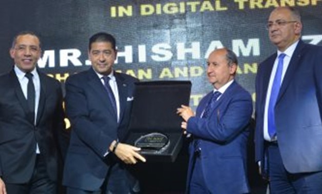 Hisham Ezz Al Arab, Chairman and Managing Director of CIB, Commercial International Bank, receiving the bt 100 crystal award