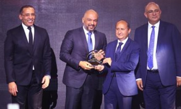 Hazem Metwaly, Chief Executive Officer at Etisalat Misr, Etisalat Misr, receiving the bt100 crystal award