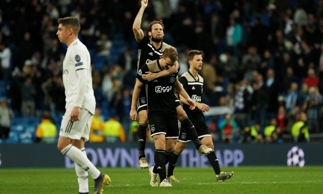 Soccer Football - Champions League - Round of 16 Second Leg - Real Madrid v Ajax Amsterdam - Santiago Bernabeu, Madrid, Spain - March 5, 2019 Ajax's Daley Blind celebrates with Matthijs de Ligt at the end of the match REUTERS/Susana Vera
