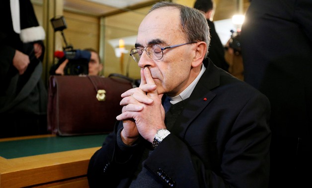 FILE PHOTO: Cardinal Philippe Barbarin, Archbishop of Lyon, arrives to attend his trial, charged with failing to act on historical allegations of sexual abuse of boy scouts by a priest in his diocese, at the courthouse in Lyon, France, January 7, 2019. RE