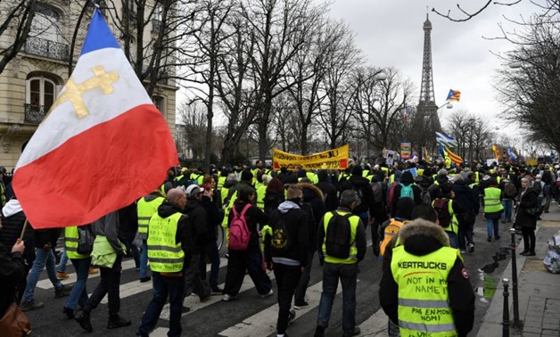 Eric Feferberg, AFP | Protesters take part in an anti-government demonstration called by the Yellow Vest movement, on the Champs-Elysees avenue in Paris, on March 2, 2019.
