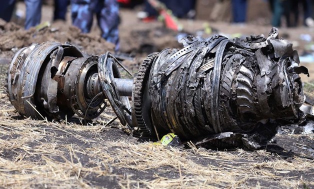 Airplane engine parts are seen at the scene of the Ethiopian Airlines Flight ET 302 plane crash, near the town of Bishoftu, southeast of Addis Ababa, Ethiopia March 11, 2019. REUTERS/Tiksa Negeri
