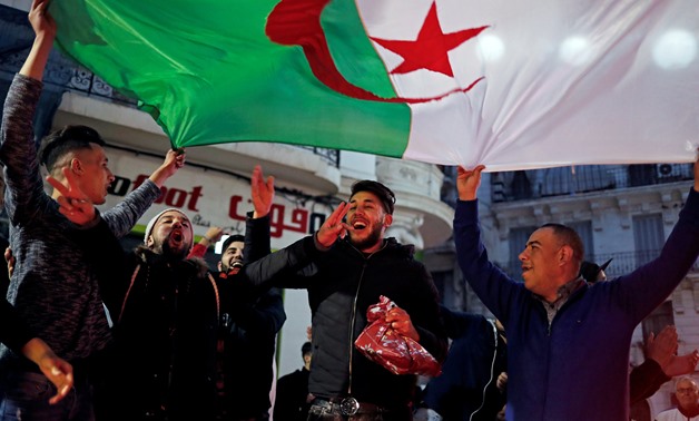People celebrate on the streets after President Abdelaziz Bouteflika announced he will not run for a fifth term, in Algiers, Algeria March 11, 2019. REUTERS/Zohra Bensemra TPX IMAGES OF THE DAY
