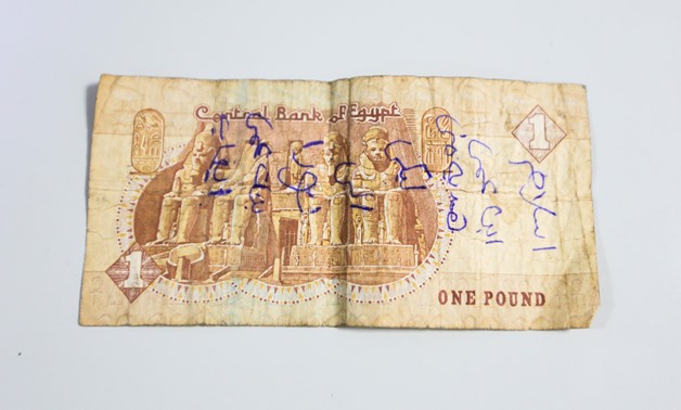 Egyptian banknotes with scribbles - Photo taken by Hassan Mohamed/Egypt Today 