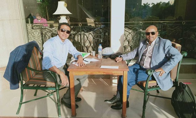 Writer Hassan Ghazaly (L) and IGAD official (R) during interview - Egypt Today