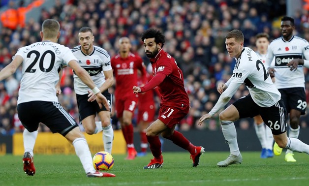 Soccer Football - Premier League - Liverpool v Fulham - Anfield, Liverpool, Britain - November 11, 2018 Liverpool's Mohamed Salah in action with Fulham's Maxime Le Marchand and Alfie Mawson. REUTERS/Russell Cheyne
