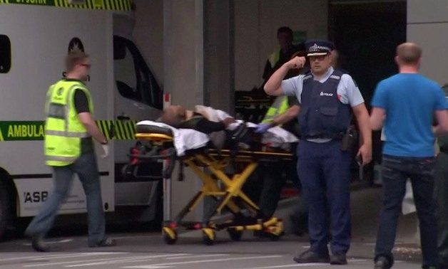 mergency services personnel transport a stretcher carrying a person at a hospital, after reports that several shots had been fired, in central Christchurch, New Zealand March 15, 2019, in this still image taken from video. 