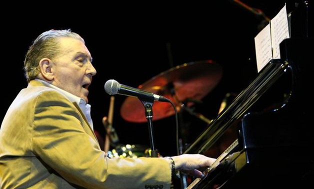 FILE PHOTO: U.S. rock and roll and country music singer and pianist Jerry Lee Lewis performs during his concert in Budapest October 31, 2010. REUTERS/Bernadett Szabo.