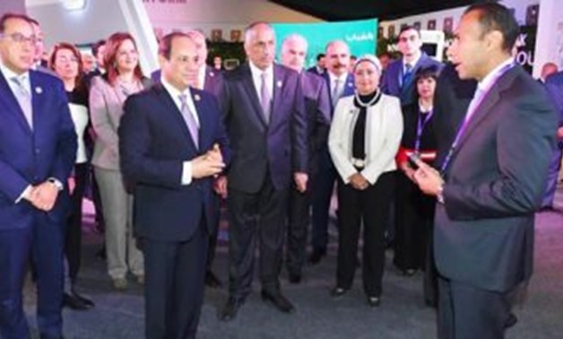 President Abdel Fatah al-Sisi during his visit the Aswan pavilion of the National Bank of Egypt on the sidelines of the Arab-African Youth Platform - Press Photo