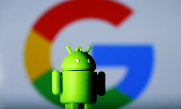 A 3D printed Android mascot Bugdroid is seen in front of a Google logo in this illustration. (REUTERS/File)

