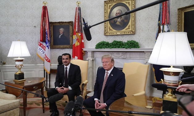 U.S. President Donald Trump meets with the Emir of Qatar Sheikh Tamim bin Hamad Al Thani, in the Oval Office at the White House on April 10. MARK WILSON/GETTY IMAGES
