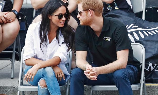 FILE PHOTO: Britain's Prince Harry (R) arrives with girlfriend actress Meghan Markle at the wheelchair tennis event during the Invictus Games in Toronto, Ontario, Canada September 25, 2017. REUTERS/Mark Blinch/File Photo.