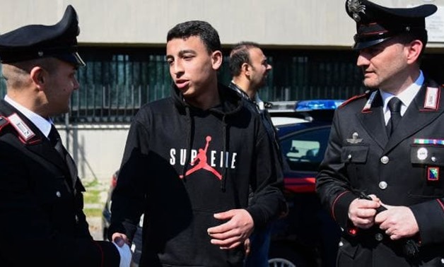 Ramy Shehata meets with some of the Carabinieri policemen who came to help. Picture: Miguel Medina/AFP.