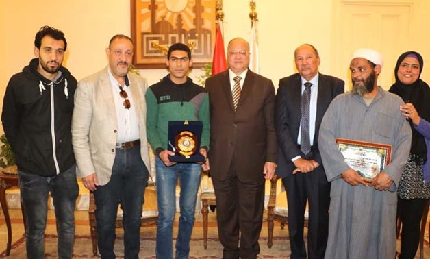 Cairo governor honors Gehad Youssef for rescuing four people in Cairo's al-Zawya al-Hamra – Press photo