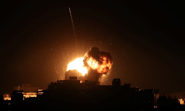 Flame and smoke are seen during an Israeli air strike in Gaza City March 25, 2019. REUTERS/Suhaib Salem
