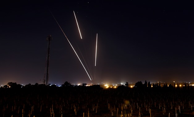 Streaks of light are pictured as rockets are launched from the Gaza Strip towards Israel, as seen from the Israeli side of the border March 25, 2019 REUTERS/Amir Cohen

