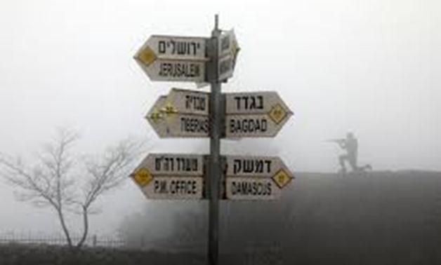 Signs pointing out distances to different cities is seen on Mount Bental, an observation post in the Israeli-occupied Golan Heights that overlooks the Syrian side of the Quneitra crossing March 25, 2019. REUTERS/Ammar Awad
