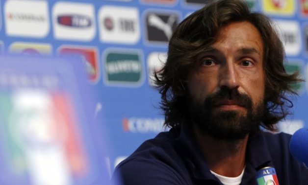 Italy's national soccer player Andrea Pirlo looks on during a news conference ahead of the 2014 World Cup at the Casa Azzurri in Mangaratiba June 11, 2014. REUTERS/Alessandro Garofalo