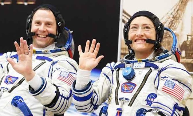 In this file photo taken on March 14, 2019 NASA astronauts Christina Hammock Koch and Nick Hague, members of the International Space Station (ISS) expedition 59/60, react shortly before the launch onboard the Soyuz MS-12 spacecraft from the Russian-leased