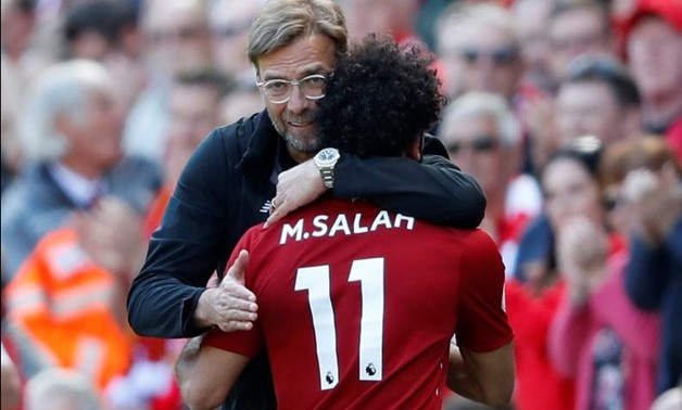 Liverpool's Mohamed Salah is hugged by manager Juergen Klopp as he is substituted. Reuters/Carl Recine 