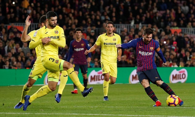 Soccer Football - La Liga Santander - Barcelona v Villarreal - Camp Nou, Barcelona, Spain - December 2, 2018 Barcelona's Lionel Messi shoots at goal as Villarreal's Alvaro attempts to block REUTERS/Albert Gea 