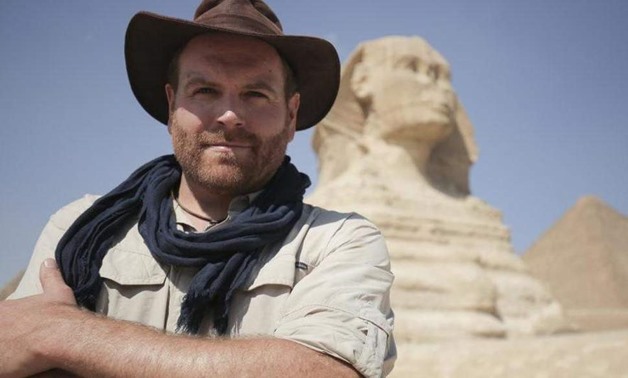 Host Josh Gates in front of the Great Sphinx of Giza in Egypt - Courtesy of Discovery Channel