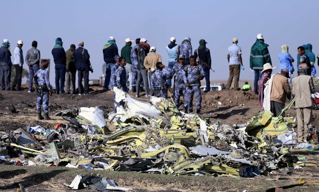 Ethiopian Federal policemen stand at the scene of the Ethiopian Airlines Flight ET 302 plane crash, near the town of Bishoftu, southeast of Addis Ababa, Ethiopia March 11, 2019. REUTERS/Tiksa Negeri