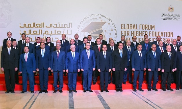 President Abdel Fatah al-Sisi and members of Supreme Council of Universities and Council of Researcher Centers and Institutions pose for a picture on the sidelines of Global Forum for Higher Education and Scientific Research in the Administrative Capital 