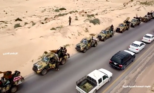 An aerial view shows military vehicles on a road in Libya, April 4, 2019, in this still image taken from video. Reuters TV via REUTERS
