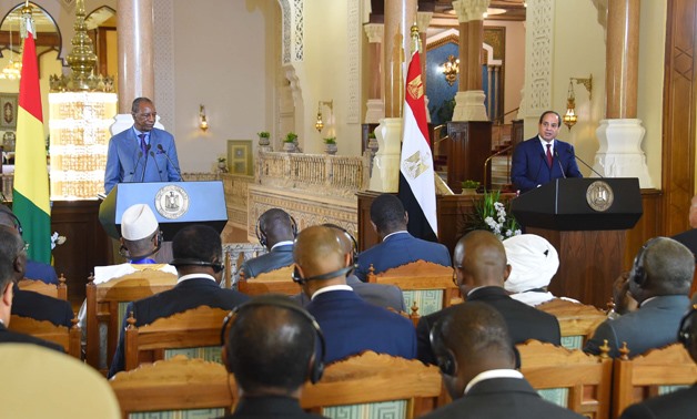 President Abdel Fatah al-Sisi (R) and Guinean counterpart Alpha Conde (L) in a joint press conference - File photo