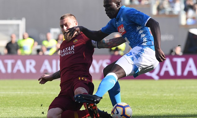 Soccer Football - Serie A - AS Roma v Napoli - Stadio Olimpico, Rome, Italy - March 31, 2019 AS Roma's Daniele De Rossi in action with Napoli's Kalidou Koulibaly REUTERS/Alberto Lingria	