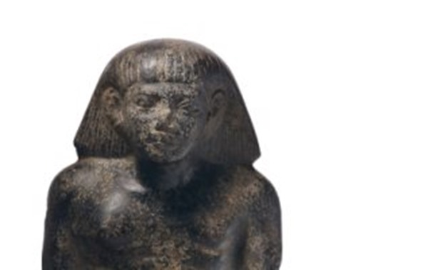 File - Ancient Egyptian basalt statue to be auctioned in Christie’s on April 29.