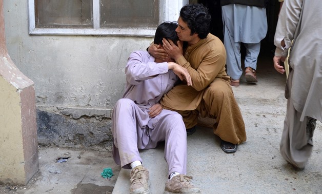 Men mourn the death of a relative at a hospital after a blast at a vegetable market in Quetta, Pakistan April 12, 2019. REUTERS/Stringer NO RESALES. NO ARCHIVES.
