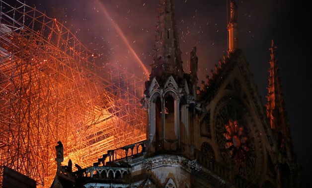Blaze devastates Notre-Dame; Paris firefighters fear for one bell tower - Reuters
