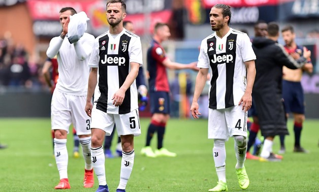 Genoa, Italy - March 17, 2019 Juventus' Miralem Pjanic and Martin Caceres react after the match REUTERS/Massimo Pinca