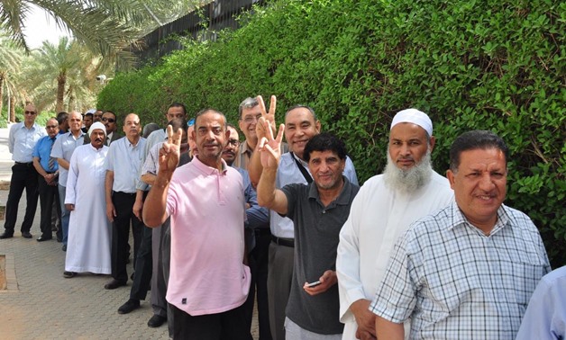 Egyptian expatriates line up in a queue outside the Egyptian embassy in Riyadh to vote  in the public referendum on the new constitutional amendments on Friday- press photo