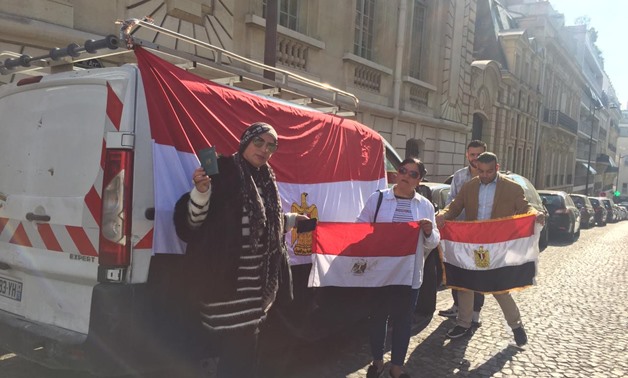 Voters in referendum on draft constitutional amendments standing in front of Egypt’s embassy in Paris, France. April 19, 2019. Press Photo