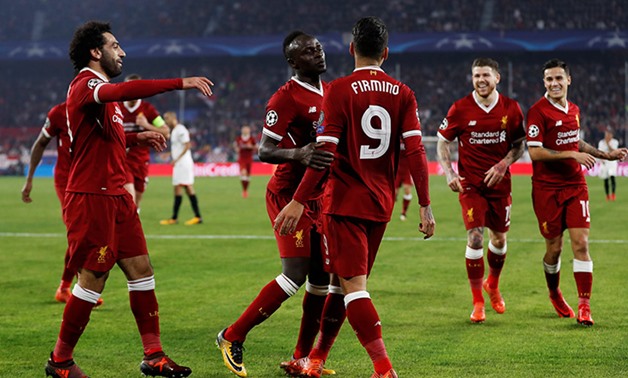 Liverpool players celebrate scoring a goal, Reuters 