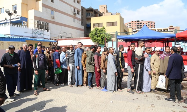 Queues of voters outside polling stations casting their ballot in referendum in Egypt - Egypt Today