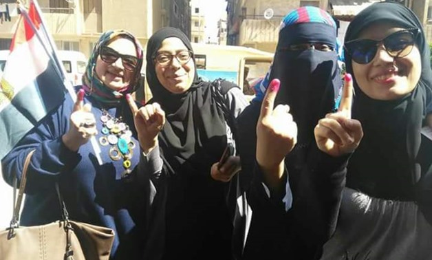 Voters in Port Said posing for a photo after casting their ballots on the second day of the referendum on constitutional amendments. April 21, 2019. 