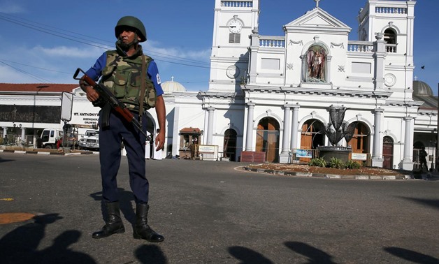 A security officer stands in front of St Anthony's shrine in Colombo, after bomb blasts ripped through churches and luxury hotels on Easter, in Sri Lanka April 22, 2019. REUTERS/Athit Perawongmetha
