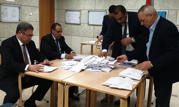 Egyptian ambassador to Germany Badr Abdel-Atti and other members of the diplomatic missions sort the expats’ ballots on the constitutional amendments at the embassy in Berlin on Monday, April 22,2019- Press photo