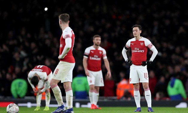 January 25, 2019 Arsenal's Mesut Ozil looks dejected after Manchester United's third goal REUTERS/Hannah McKay